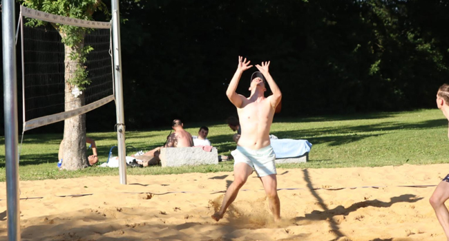 Playing Beach Volleyball at the lakeside.